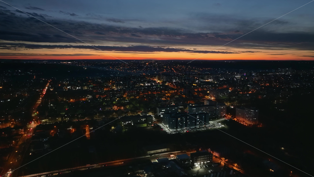 Video - Aerial drone view of Chisinau city at night, blue hour. Moldova