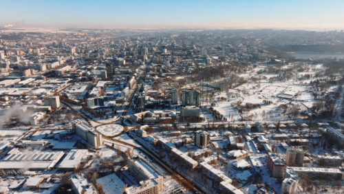 Video - Aerial drone view of the city covered in snow. Sunrise during winter in Chisinau, Moldova