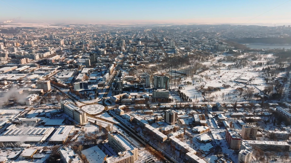 Video - Aerial drone view of the city covered in snow. Sunrise during winter in Chisinau, Moldova