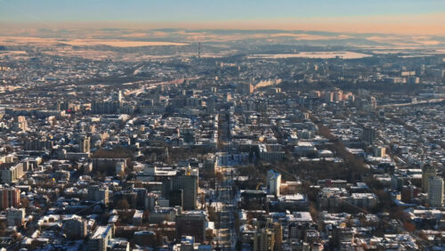 Video - Aerial drone view of the city center covered in snow. Sunrise during winter in Chisinau, Moldova