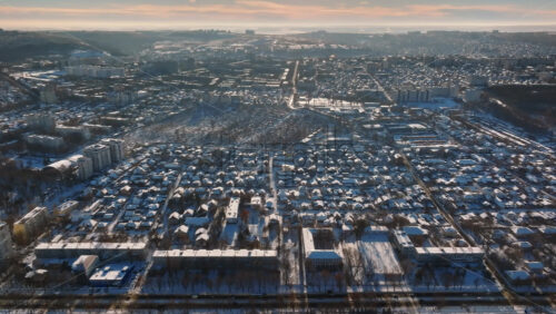 Video - Aerial drone view of the city covered in snow. Sunrise during winter in Chisinau, Moldova