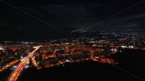 Video - Aerial drone view of Chisinau city covered in snow at night, blue hour. Moldova