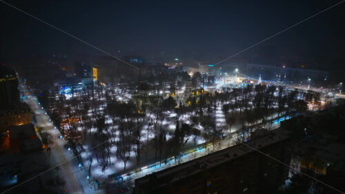 Video - Aerial drone view of Chisinau center city covered in snow. Cathedral and Government building at night. Moldova
