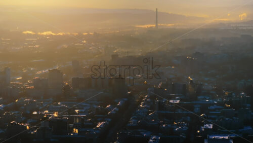 Video - Aerial drone view of the city covered in snow. Sunset during winter in Chisinau, Moldova