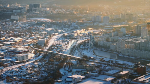 Video - Aerial drone view of Chisinau city covered in snow at sunset. Winter in Moldova