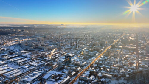 Video - Aerial drone view of the city covered in snow. Sunrise during winter in Chisinau, Moldova
