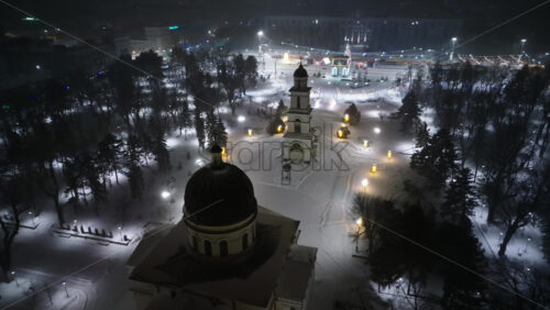 Video - Aerial drone view of Chisinau center city covered in snow. Cathedral and Government building at night. Moldova