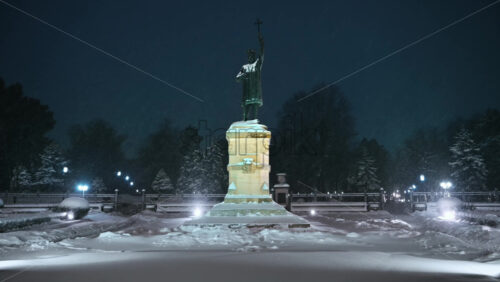 Video - Stephen the Great monument during a snowfall. Blue hour. Winter evening in Chisinau, Moldova