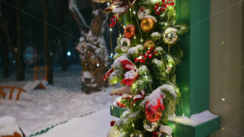 Video - Christmas decorations in the park during snowfall. Winter evening