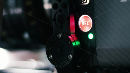 Video - Glowing Record buttons on a professional video camera on the movie set