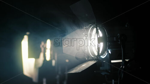 Video - Professional lighting equipment on the movie set with smoke in the air