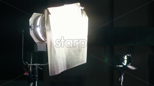 Video - Professional lighting equipment on the movie set with cape on it