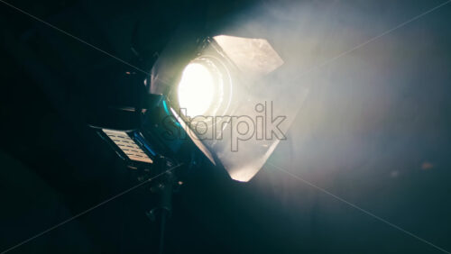 Video - Professional lighting equipment on the movie set with smoke in the air