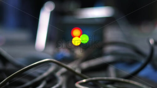 Video - CHISINAU, MOLDOVA - MARCH 28, 2021: Professional lighting equipment on the movie set. Electronic ballast and a lot of cables. Walking man on background