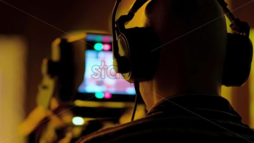 Video - Man filming with professional camera on the backstage of a TV set