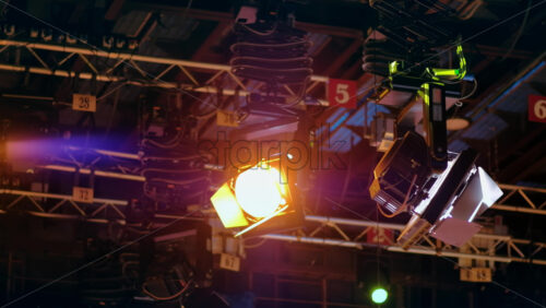 Video - Flashing studio lights equipment on the ceiling of a TV set