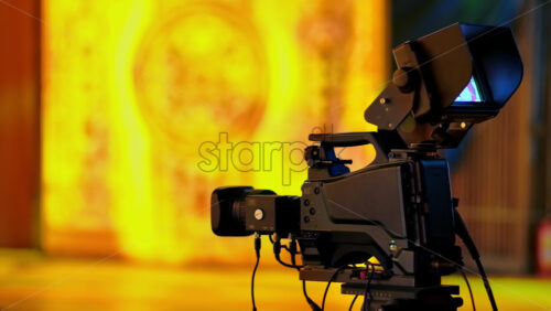 Video - Professional camera filming with on the backstage of a TV set