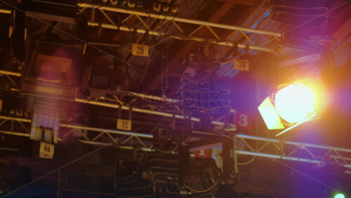 Video - Flashing studio lights equipment on the ceiling of a TV set
