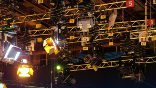 Video - Flashing studio lights equipment on the ceiling of a TV set