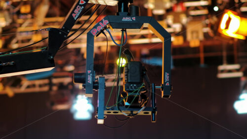 Video - Chisinau, Moldova - March 29, 2024: Camera equipment and flashing studio lights on the ceiling of a TV set