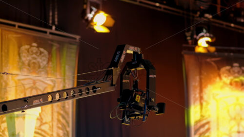 Video - Chisinau, Moldova - March 29, 2024: Camera equipment and flashing studio lights on the ceiling of a TV set