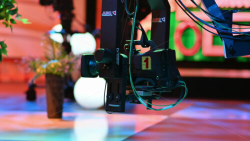 Video - Chisinau, Moldova - January 16, 2024: Professional television camera Sony with the Exmor technology mounted on a crane from ABC Products in a dark studio. Video production backstage
