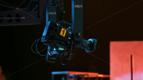 Video - Chisinau, Moldova - January 16, 2024: Professional television camera Sony with the Exmor technology mounted on a crane from ABC Products in a dark studio. Video production backstage