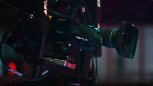 Video - Chisinau, Moldova - January 16, 2024: Professional television camera Sony with the Exmor technology mounted on a crane from ABC Products in a dark studio. Video production backstage