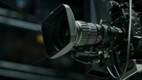 Video - Chisinau, Moldova - January 16, 2024: Professional television camera Sony with Fujifilm lenses mounted on a crane in a studio. Spotlights illuminating the scene. Video production backstage