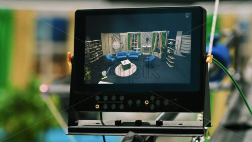Video - External monitor from a video camera crane displaying the television studio. Video production backstage