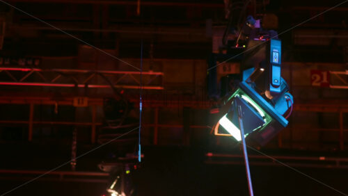 Video - Adjusting barn doors of the professional light with a metal pipe in a television studio