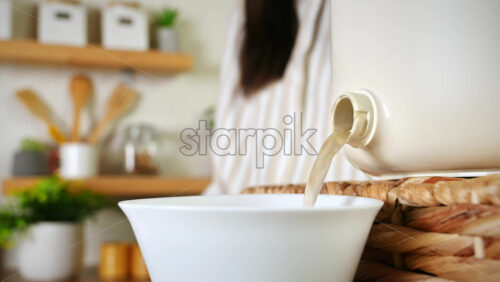 Video - Woman harvesting environmentally friendly fertilizer from organic waste in a bokashi container at home. Ecological and sustainability concept