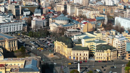 Video - Bucharest, Romania - March 03, 2024: Aerial drone view of Carol I University Foundation. Main building with Carol I statue in front of it, roads and buildings