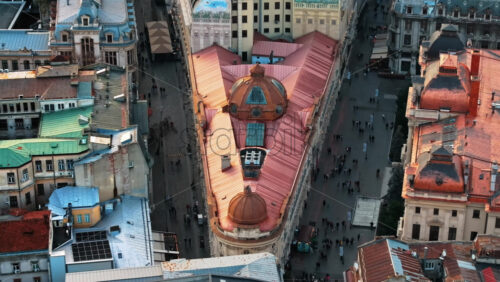 Video - Bucharest, Romania - March 03, 2024: Aerial drone view of Pinacotecii palace building with walking people in the old town