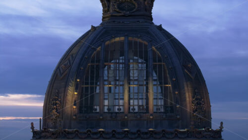 Video - Aerial drone view of the illuminated Palace of the Deposits and Consignments in the evening. Blue hour in Bucharest, Romania