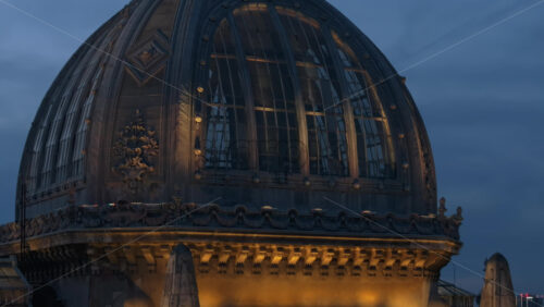 Video - Aerial drone view of the illuminated Palace of the Deposits and Consignments in the evening. Blue hour in Bucharest, Romania