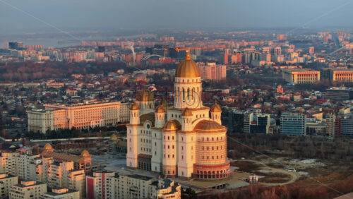 Video - Aerial drone view of People's Salvation Cathedral near the Palace of the Parliament. Sunset in Bucharest, Romania