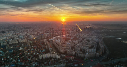 Video - Aerial drone view of Bucharest city at sunset. Moving traffic. Romania