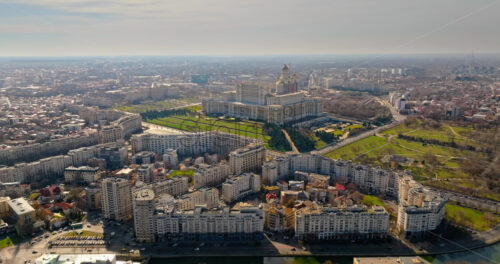 Video - Bucharest, Romania - March 03, 2024: Aerial drone view of Palace of the Parliament in the city center. Sunny day