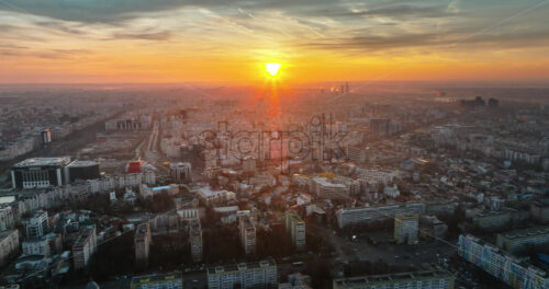 Video - Aerial drone view of Bucharest city at sunset. Moving traffic. Romania