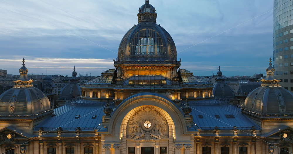 Video - Aerial drone view of the illuminated Palace of the Deposits and Consignments in the evening. Blue hour in Bucharest, Romania