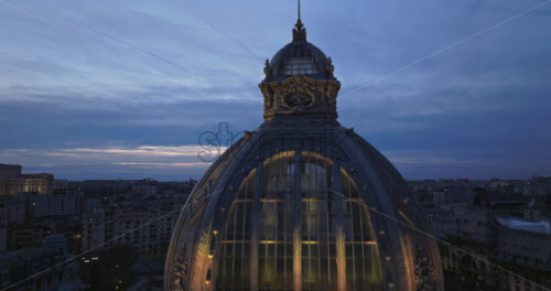 Video - Aerial drone view of the illuminated Palace of the Deposits and Consignments in the evening. Blue hour in Bucharest, Romania