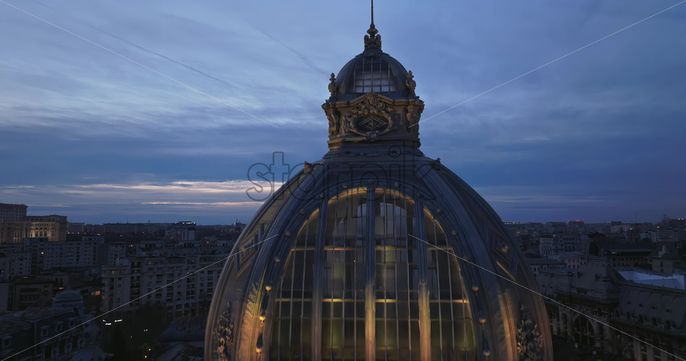 Video - Aerial drone view of the illuminated Palace of the Deposits and Consignments in the evening. Blue hour in Bucharest, Romania
