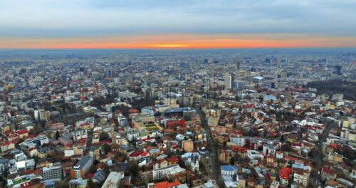 Video - Aerial drone view of Bucharest cityscape at sunset. Blue hour in Romania