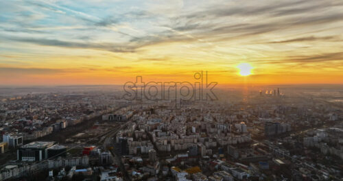 Video - Aerial drone view of Bucharest city at sunset. Moving traffic. Romania