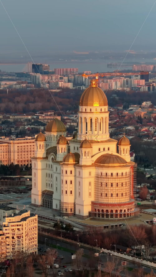 Video - Vertical aerial drone view of People's Salvation Cathedral near the Palace of the Parliament. Sunset in Bucharest, Romania