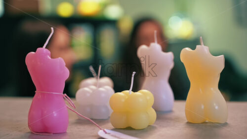 Video - Hand made colored candles with two women on the background