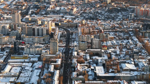 Video - Aerial drone view of Chisinau city center, covered in snow at sunset. Winter in Moldova