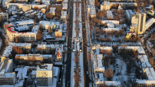 Video - Aerial drone view of Chisinau city center, covered in snow at sunset. Winter in Moldova