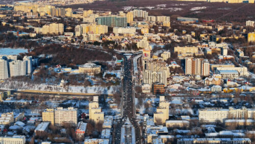 Video - Aerial drone view of Chisinau city center, covered in snow at sunset. Winter in Moldova
